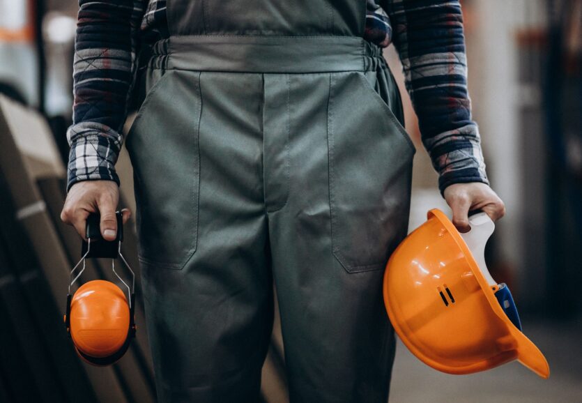 young-male-handyman-with-safety-earphones